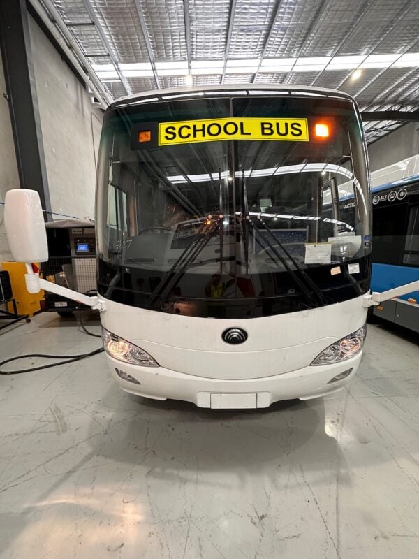 Photo of the front of a Yutong D9 bus with Safebus SB001B window mount school bus lights and Victorian school bus lights large signage installed