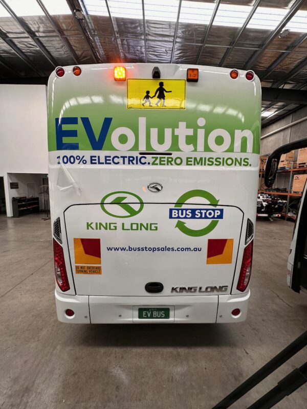 Photo of the rear of a 57 seater electric EV King Long bus with Safebus SB001A surface mount school bus lights and Victorian signage installed