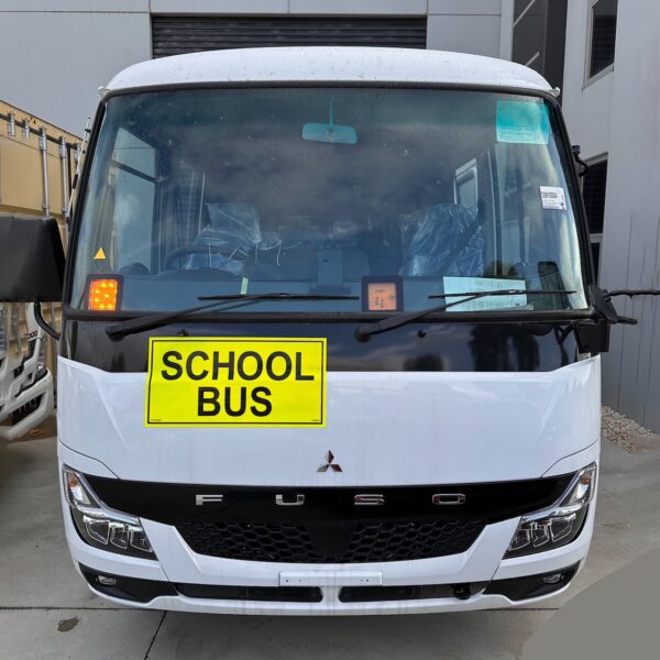 Photo of the front of a 2024 5th generation BE7 Mitsubishi Rosa bus with Safebus SB001B window mount Victorian school bus lights and signage installed