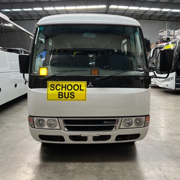 Photo of the front of a 2018 4th generation BE6 Mitsubishi Rosa bus with Safebus SB001B window mount Victorian school bus lights and signage installed