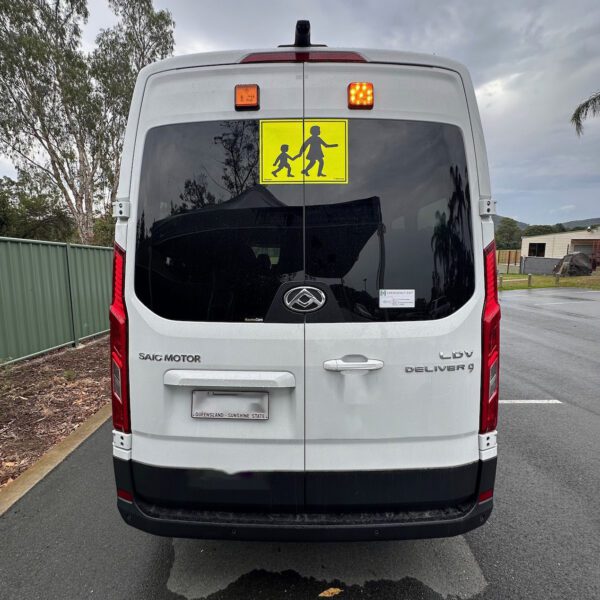 Photo of the rear of a 2024 LDV bus with Victorian Safebus SB001A surface mount school bus lights and mother & child sign