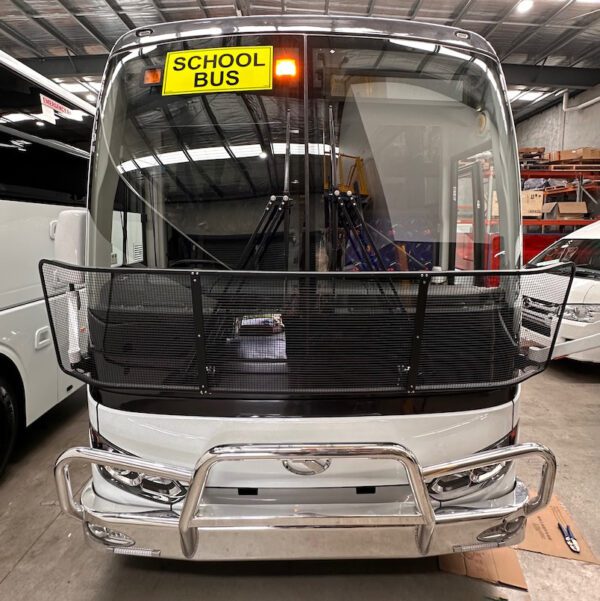 Photo of the front of a 57 seater King Long bus with Safebus SB001B window mount school bus lights and Victorian signage installed