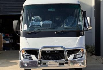 Photo of the front of a 2024 5th generation BE7 Mitsubishi Rosa bus with a Safebus Bullbar fitted